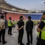 Petugas keamanan dan steward memeriksa area stadion sebelum pertandingan sepak bola Liga Indonesia